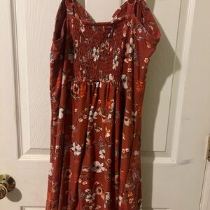 Floral dress that is a soft stretchy material with adjustable straps.